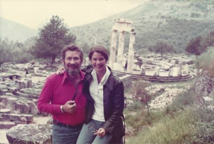 man and woman in front of Greek ruins