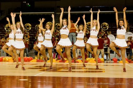 cheerleading squad preforming on basketball court