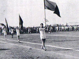 black and white image of men carrying flags