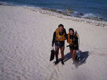 Muska Mosston and Sara Ashworth on the beach with scuba gear