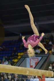 female gymnast on the balance beam
